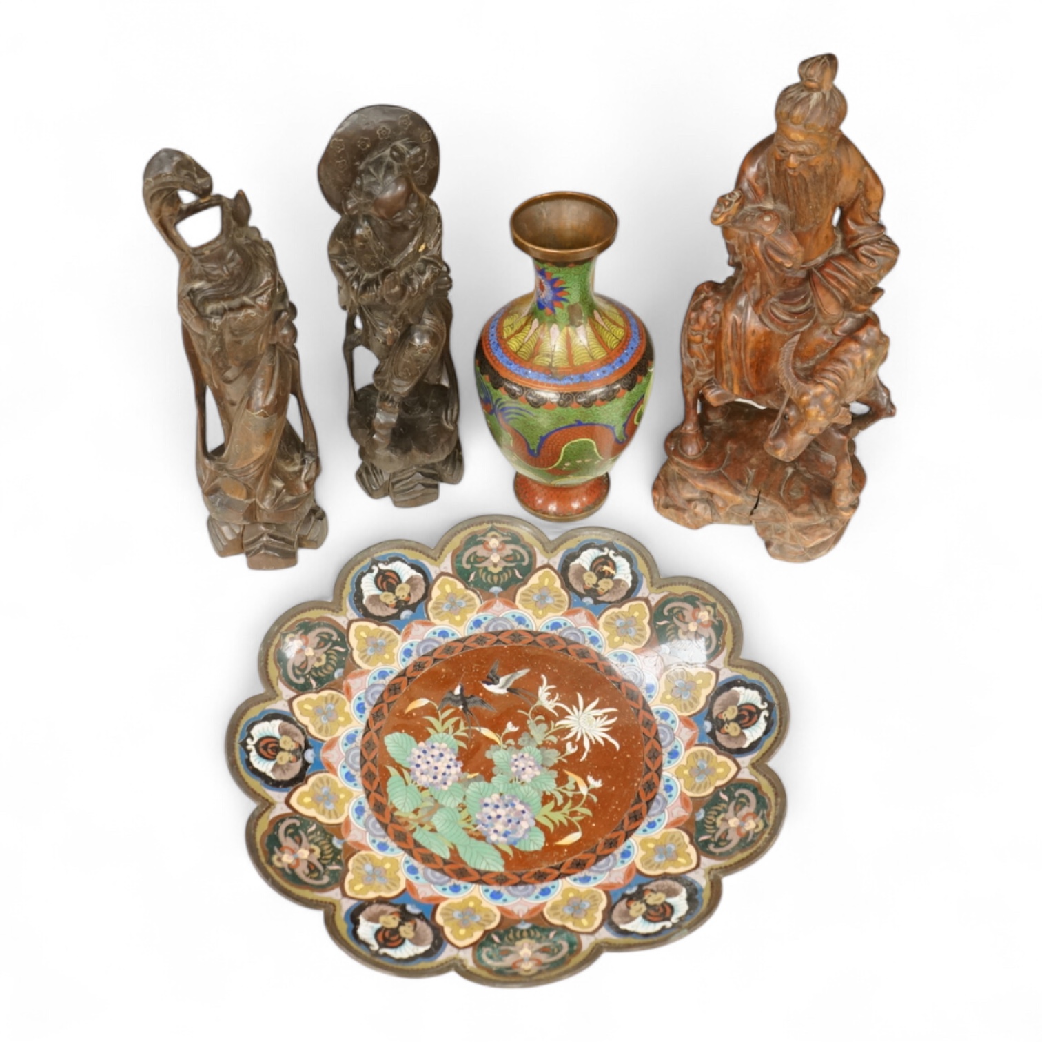 A Japanese cloisonné enamel dish, a Chinese cloisonné enamel vase and three Chinese carved wood figures, largest 39cm high
